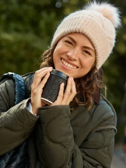 Avoine - Bonnet à pompon en maille pointelle