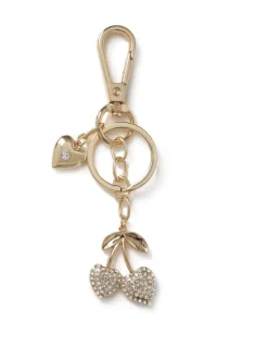 Breloque Aela dorée scintillante avec sac à cerise