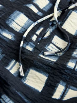 Carreaux bleu marine/écru - Chemisier décontracté à manches longues avec trou de serrure