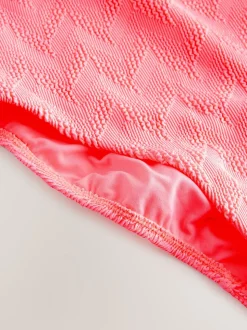 Corail rose fluo texturé - Maillot de bain gainant à encolure dégagée