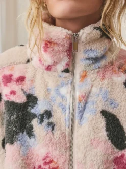 Crème fleuri - Polaire en imitation peau de mouton à col zippé