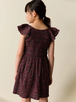 Ditsy noir - Robe smockée à manches volantées (3-16ans)