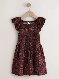 Ditsy noir - Robe smockée à manches volantées (3-16ans)