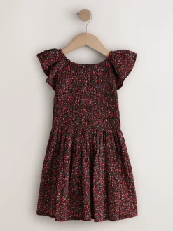 Ditsy noir - Robe smockée à manches volantées (3-16ans)