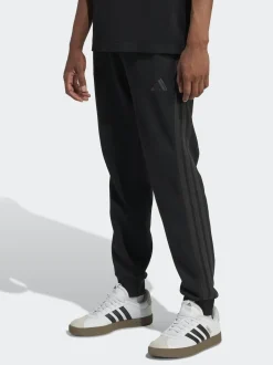 Ground noires - adidas Essentiels Pantalon de jogging polaire à rayures 3