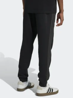 Ground noires - adidas Essentiels Pantalon de jogging polaire à rayures 3
