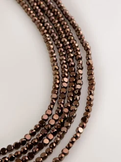 Marron chocolat - Collier plat à facettes avec gradins de perles graduées