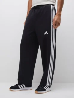 Noir - Pantalons à jambe large en polaires à trois rayures adidas Essentials