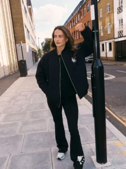 Noir brodé - Leggings évasés en coton Never Fully Dressed