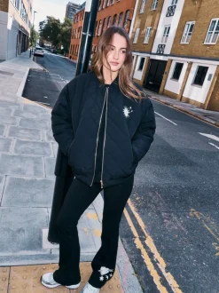 Noir brodé - Leggings évasés en coton Never Fully Dressed