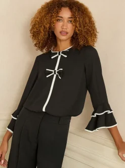 Noir et blanc avec nœud - Chemisier Love & Roses plissé à manches flûte à col rond