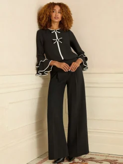 Noir et blanc avec nœud - Chemisier Love & Roses plissé à manches flûte à col rond