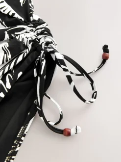 Noir/Crème Palmier - Maillot de bain Bandeau gainant à jambes froncées