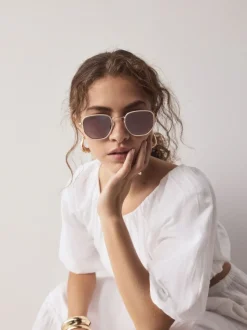 os - Lunettes de soleil rondes en métal