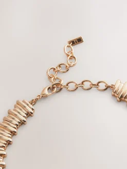 Tonalité d'or - Collier à col cranté