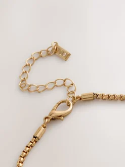 Tonalité d'or - Collier long à fleurs