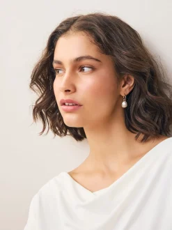 Tonalité or/argent - Boucles d’oreilles créoles à facettes